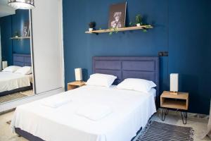 Postel nebo postele na pokoji v ubytování Appartement moderne face au parc la Marsa