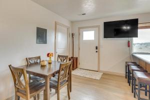 a dining room with a wooden table and chairs at Near Dinosaur Natl Monument! High Desert Hideaway in Naples