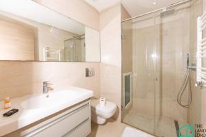 a bathroom with a shower and a sink and a toilet at B13 New cosy 1 bedroom in La Marsa in Sidi Daoud +5 photos