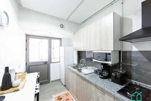 a kitchen with a sink and a counter top at New 1 bedroom with swimming pool next to Lac 2 in El Aouina Station