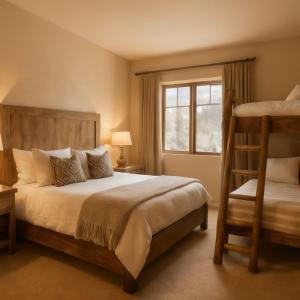 a bedroom with two bunk beds and a window at Mountain Sky Stay in Aspen