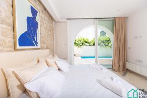 Ένα ή περισσότερα κρεβάτια σε δωμάτιο στο Le duplex du Golden Tulip