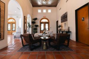 a living room with a table and chairs at Luxury Apartment Home in Mission