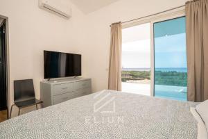 TV a/nebo společenská místnost v ubytování Piece of Paradise