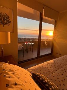 Postel nebo postele na pokoji v ubytování Departamento Costa Quintay