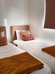 Postel nebo postele na pokoji v ubytování The Rewind Retreat