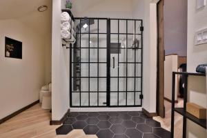 a room with a gate with a toilet in it at Hidden Dome Retreat in the Trees in Barview +36 photos