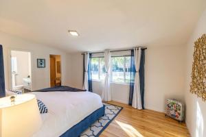 a bedroom with a bed and a large window at Crown Point Hideaway in Crown Point