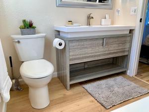 a bathroom with a toilet and a sink at Crown Point Hideaway in Crown Point +24 photos