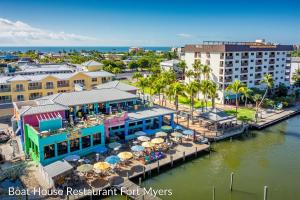 an aerial view of a resort with tables and umbrellas at Florida Flair Villa in Cape Coral Hospital Heliport