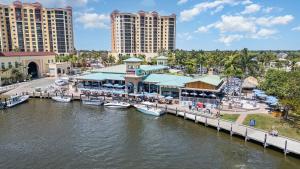 a marina at a resort with boats in the water at Funky Fish House Villa in Shell Point Village