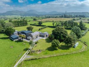 an aerial view of a house in a field at Muriau-Bach in Dolbenmaen