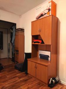 a large wooden cabinet in a room at Nature Heaven in Carlsbad in Karlovy Vary