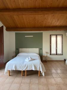 Postel nebo postele na pokoji v ubytování Locanda Merlaschio