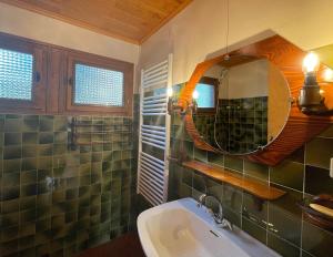 a bathroom with a sink and a mirror at South-facing Chalet With Views in Le Villard-Late
