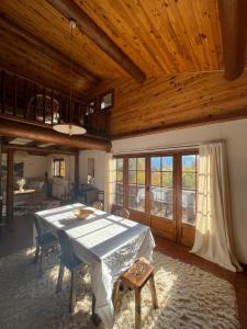 a dining room with a table and chairs in a house at South-facing Chalet With Views in Le Villard-Late