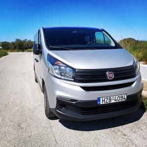 a white van parked on the side of a road at House100 in Kos Town