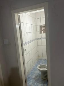a bathroom with a toilet in a room at Hotel Automatiza no Centro da Cidade in Uberaba +10 photos