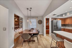 a kitchen with a table and chairs and a refrigerator at 227 Goldstein in Punta Gorda