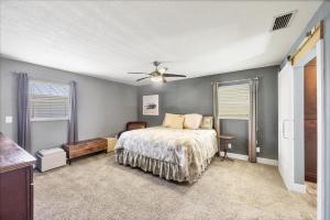 a bedroom with a bed and a ceiling fan at 227 Goldstein in Punta Gorda