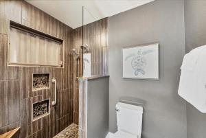 a bathroom with a toilet and a shower at 227 Goldstein in Punta Gorda +30 photos