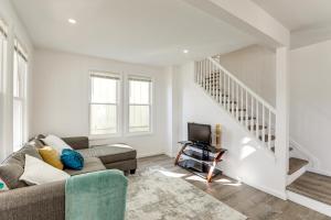 a living room with a couch and a tv at 10 Mi to Lincoln Financial Field Family Home! in Colonial Manor