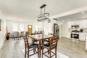 a kitchen and living room with a table and chairs at 10 Mi to Lincoln Financial Field Family Home! in Colonial Manor