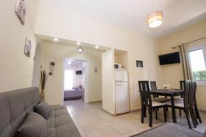 a living room with a couch and a table at Ipsos Wave Apartments in Ipsos