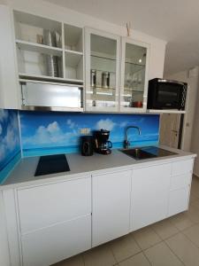 Kuchyň nebo kuchyňský kout v ubytování Apartment 7M, Lagada Resort