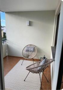 a living room with a chair and a table at Apartment O&V 2 in Waldshut-Tiengen