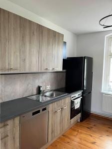 Kuchyň nebo kuchyňský kout v ubytování Apartment Rosi - Gemütliche und moderne Ferienwohnung in der Innenstadt