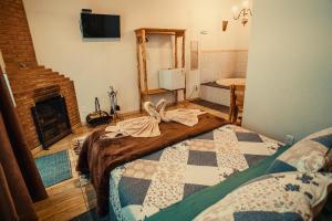 Postel nebo postele na pokoji v ubytování Pousada Recanto dos Pássaros