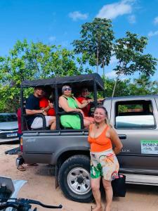 a group of people in the back of a truck at Sol Dos Lençois Pousada in Barreirinhas +12 photos
