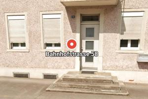 a building with a white door and a red target at Helle, gemütliche Wohnung an der grenze vom Deutschland in Koblenz
