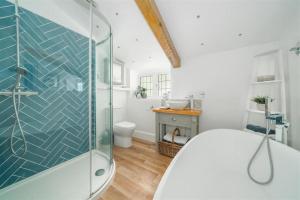 a bathroom with a glass shower and a toilet at Cyclists Rest Matlock in Matlock +18 photos