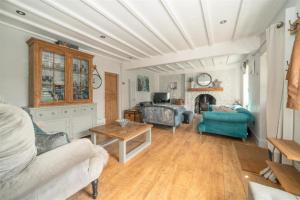 a living room with a couch and a table at Cyclists Rest Matlock in Matlock