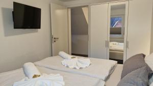 Ένα ή περισσότερα κρεβάτια σε δωμάτιο στο Pension Likedeeler