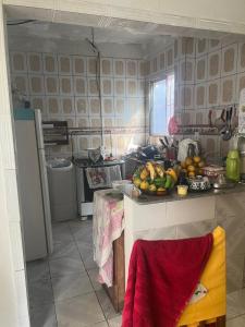 a kitchen with a bunch of fruit on a counter at Casa de Elvira in Belém +4 photos