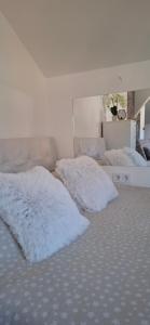 two white pillows on a bed in a room at APARTMENTS IVANOViC CENTER CITY in Bajina Bašta