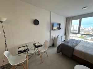 Et tv og/eller underholdning på ESPACIO ESTOMBA 666 Elegante estudio con cochera