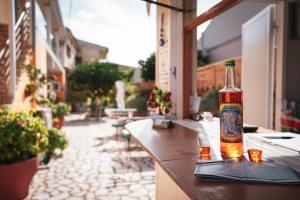 a bottle of alcohol sitting on top of a bar at Ipsos Wave Apartments in Ipsos