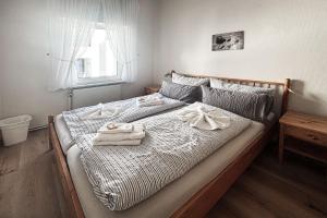 Ένα ή περισσότερα κρεβάτια σε δωμάτιο στο Haus Borkumitte