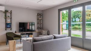 Μια τηλεόραση ή/και κέντρο ψυχαγωγίας στο Campanile NATURE - Besançon Ouest Chateaufarine