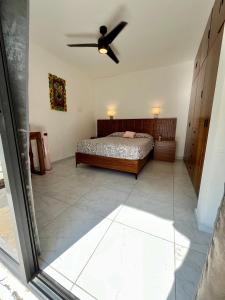 Ένα ή περισσότερα κρεβάτια σε δωμάτιο στο Casa amigos Comala