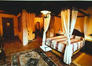 Postel nebo postele na pokoji v ubytování Posada Restaurante Ducal