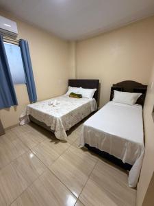 Postel nebo postele na pokoji v ubytování Hotel Caribe de Alter - Alter do Chão