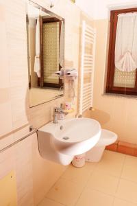 a bathroom with a white sink and a mirror at B&B Lido Azzurro in Catanzaro Lido