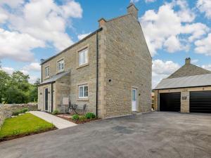 a large brick house with a garage at 4 Bed in Bradwell 89431 in Bradwell