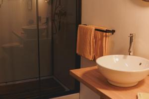 a bathroom with a white sink and a shower at Loft urbain style Brooklyn in Profondeville +44 photos