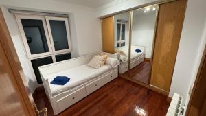 Ένα ή περισσότερα κρεβάτια σε δωμάτιο στο SANTA KATALINA MUNDAKA by Urdaibai Experience